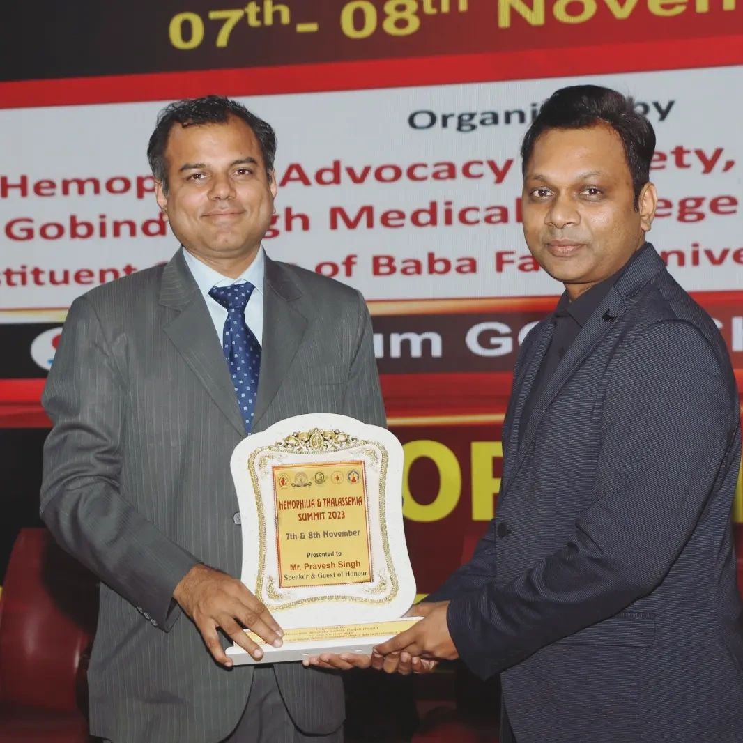 Pravesh Singh receiving Guest of Honour award plaque in Faridkot